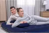 A couple lying on a blue inflatable mattress. Anteprima dell’immagine prodotto