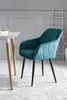 A turquoise armchair next to a white table. Produktbild-Vorschau