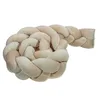 A braided baby bed bumper on a white background. Produktbild-Vorschau