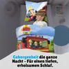 A child is sleeping on a bed with Fireman Sam themed bedding. Produktbild-Vorschau