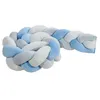A braided baby crib bumper in shades of blue and white. Produktbild-Vorschau