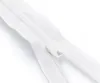 A close-up shot of a white zipper on a white background. Produktbild-Vorschau