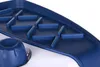 A close-up view of a blue and white appliance with a textured surface and a knob. Náhled obrázku produktu