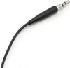 A close-up shot of a 3.5mm audio jack connector with a black cable. Voir les images du produit