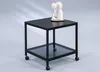 A black metal side table with a glass shelf and wheels. Produktbild-Vorschau