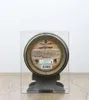A barrel-shaped bottle of Scotch whisky displayed in a clear plastic case on a stand. Produktbild-Vorschau