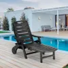A black plastic sun lounger is placed on a wooden deck next to a swimming pool. Produktbild-Vorschau