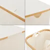 Collage of close-up shots of a beige laundry basket with wooden accents. Produktbild-Vorschau
