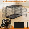A dog crate with dimensions labeled, and three dogs sitting in front of it. A folded dog crate is also shown. Produktbild-Vorschau