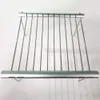 A portable, foldable stainless steel grill rack is shown against a white background. Produktbild-Vorschau