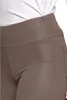 A close-up view of the waistband and pocket of beige leggings. Produktbild-Vorschau