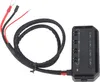 A black electronic device with wires and connectors, isolated on a white background. Voir les images du produit