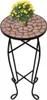 A mosaic-topped side table with a potted plant on top, isolated on a white background. Produktbild-Vorschau