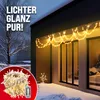 A house exterior decorated with string lights during winter. Anteprima dell’immagine prodotto