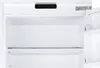 The interior of an open white refrigerator with a glass shelf. Náhľad obrázku produktu