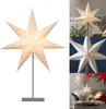 Collage of star-shaped lamps, some lit and some unlit, in various settings. Produktbild-Vorschau