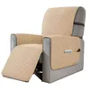 A recliner chair with a beige quilted slipcover, showing the footrest extended and side pockets with a phone and remote. Anteprima dell’immagine prodotto