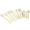 A collection of kitchen utensils arranged diagonally on a white background. Náhled obrázku produktu
