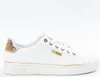 A white Guess sneaker with gold accents, shown from the side against a white background. Produktbild-Vorschau