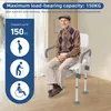 An elderly man sits on a shower chair in a room. Náhled obrázku produktu