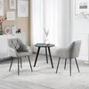 Two gray accent chairs and a small black coffee table are arranged in a living room setting. Produktbild-Vorschau