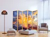 A living room scene with a folding screen, armchair, ottoman, coffee table, and floor lamp. Náhľad obrázku produktu