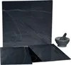 A set of slate cutting boards and a mortar and pestle on a white background. Produktbild-Vorschau
