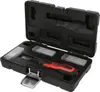 A black plastic case containing a set of tools, including a screwdriver with a red and black handle and several small plastic containers with blades. Podgląd zdjęcia produktu