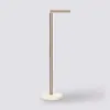 A minimalist floor lamp with a marble base. Podgląd zdjęcia produktu