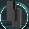A dark, abstract background with glowing blue rings frames two black phone cases. Anteprima dell’immagine prodotto