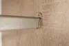 A close-up view of a metal rod attached to a wooden surface with a screw. Náhľad obrázku produktu