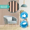 A modern living room setting with a chair and wall paneling. Produktbild-Vorschau