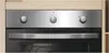Close-up of the control panel and door of a built-in oven. Voir les images du produit