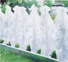 Plants covered with protective fleece in a garden bed. Produktbild-Vorschau