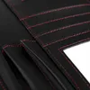 A close-up view of the interior of a black conference folder with red stitching. Voir les images du produit