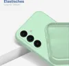 A close-up of a light green phone case, showing the camera cutout and the texture of the material. Produktbild-Vorschau