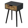 A single black and wood-grain nightstand with three black legs against a white background. Náhled obrázku produktu