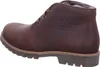 A side view of a brown leather boot with fur lining. Voir les images du produit