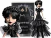 A Monster High doll dressed in a black gothic gown, with a box in the background. Náhľad obrázku produktu