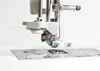 Close-up view of a sewing machine needle and presser foot. Anteprima dell’immagine prodotto