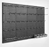 A black pegboard organizer with various hooks and small gray bins attached, displayed against a white background. Podgląd zdjęcia produktu