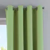 Close-up of green curtains hanging from a rod. Produktbild-Vorschau
