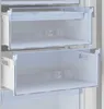 Close-up view of two empty drawers in a white refrigerator or freezer. Voir les images du produit