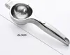 A silver metal lemon squeezer is shown on a white background with dimensions indicated by text. Produktbild-Vorschau