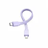 A flat lay product shot of a purple charging cable with USB-C and Lightning connectors. Podgląd zdjęcia produktu