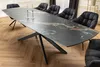 A dining table with chairs in a dining room setting. Produktbild-Vorschau