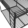 A close-up view of a black metal bunk bed frame, showing the slatted surfaces of both the top and bottom bunks. Voir les images du produit
