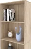 A close-up view of a wooden bookshelf with books and decorative items on its shelves. Voir les images du produit