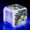 A cube-shaped digital alarm clock with a wolf motif, illuminated by blue light. Produktbild-Vorschau