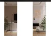 A reflection of a modern living room is shown in two mirrored sliding doors. Náhled obrázku produktu